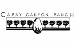 Capay Canyon Ranch logo with illustration of trees in a row with large almond in center in black and white